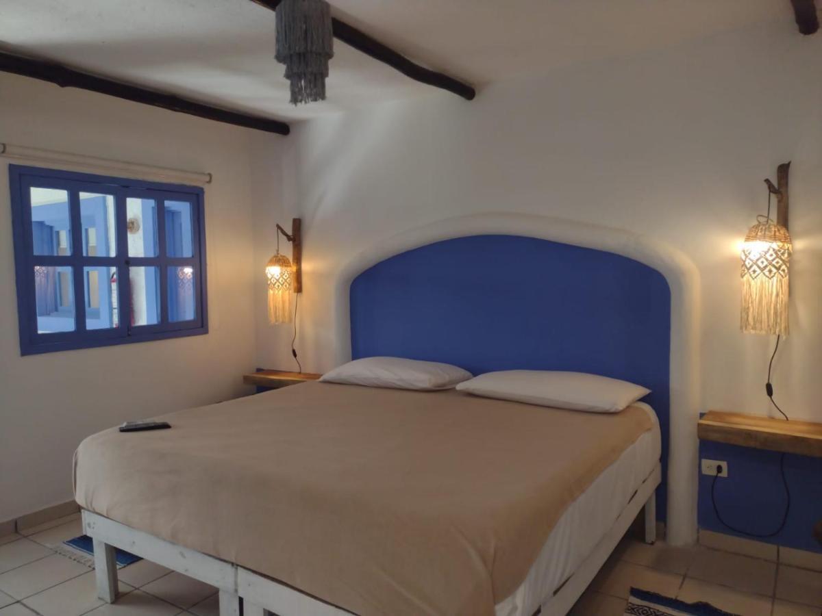 Mio Tulum Hotel Boutique Buitenkant foto A bedroom in a hotel in Tunisia