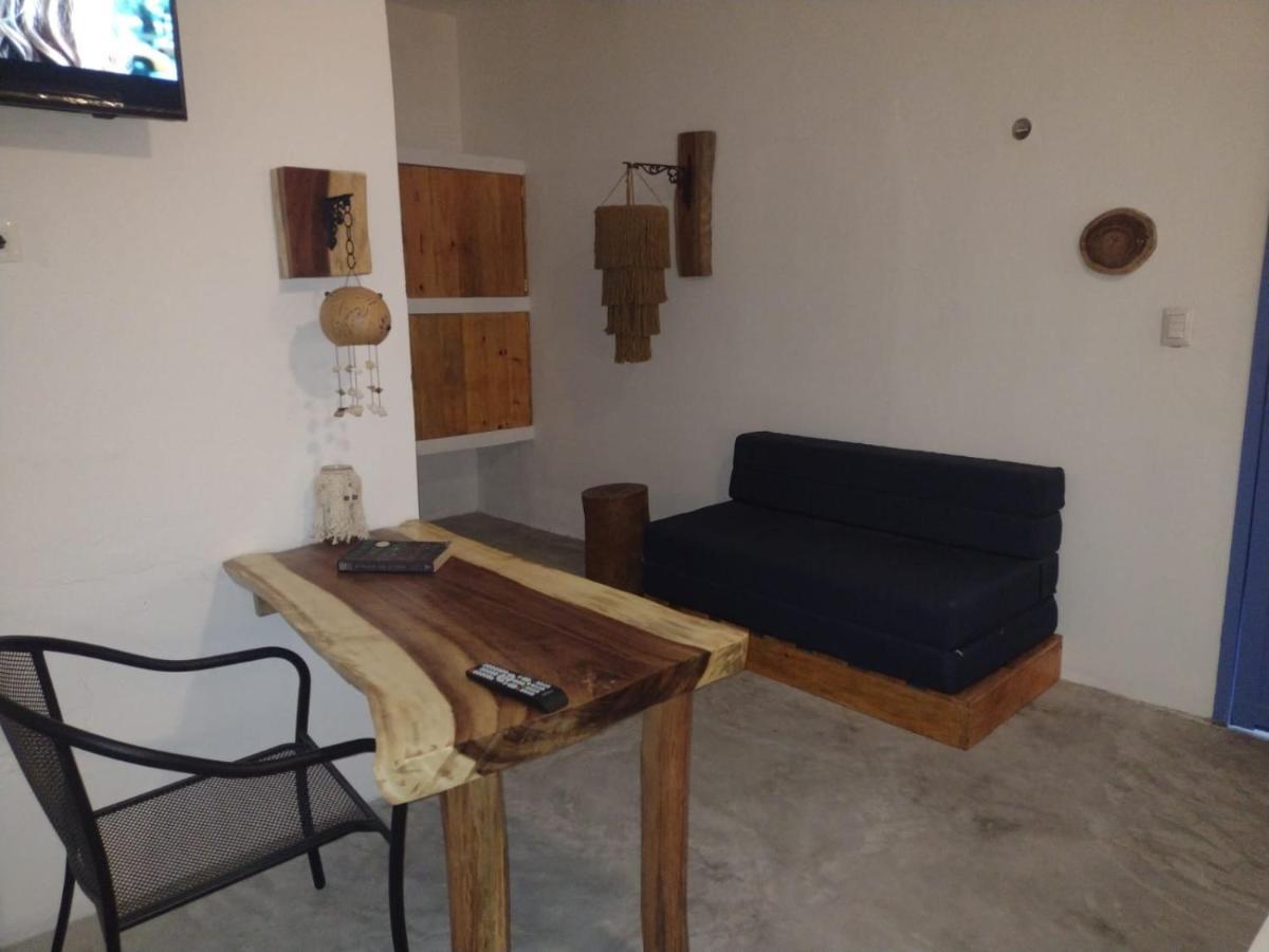 Mio Tulum Hotel Boutique Buitenkant foto A living room in a hotel in Greece
